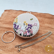 Load image into Gallery viewer, Joyhouseofseratku_This round-shaped Marigold bag features a stylish and comfortable cross-body long chain strap, hand-embroidered detail, and clasp closure for convenient carrying. Perfect for any occasion, this embroidered bag is sure to be a stylish and practical solution to your storage needs.
