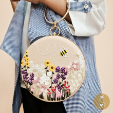 Load image into Gallery viewer, Joyhouseofseratku_The Marigold hand-embroidered bag is the perfect accessorizing essential, boasting a uniquely round shape and cross-body design. Featuring a long chain strap and rich cream color, this elegant clutch bag will make any ensemble sparkle with sophistication. Stand out with Marigold&#39;s timeless circle crossbody bag!
